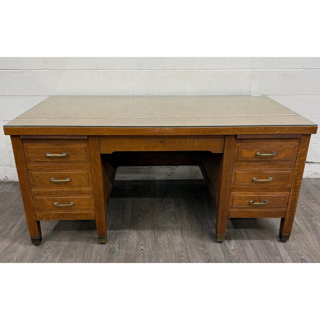This is an exceptional antique American Arts & Crafts Mission executive desk or partner desk crafted from beautiful...
