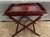 Mahogany tray table that unfolds to 89" in length. The table made by Baker Furniture in the 1950's is called the "Party...