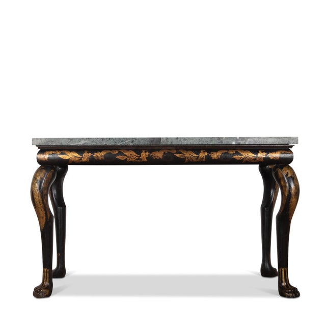 An early 19th Century black and gilt chinoiserie marble top side/console table. The Greek green marble top above a cushion...