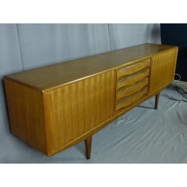 Large vintage teak buffet with behind the scenes and four drawers on the front. High quality construction furniture and in...