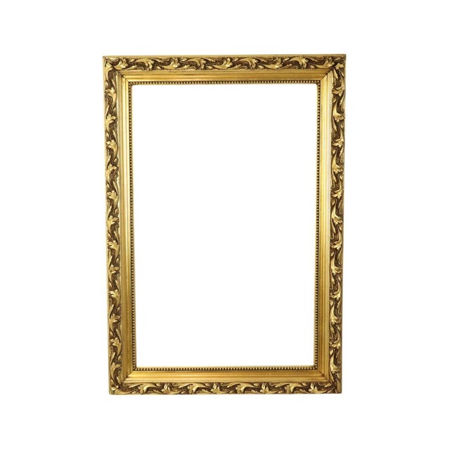 Beautiful large antique Baroque style frame made of pine wood with gesso acanthus relief decoration; the entire piece is...