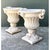 This pair of vintage cast stone garden urns presents a classical Campana silhouette, each with a deeply fluted bowl rising...