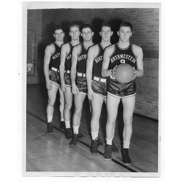 1938 black and white photo of the Northwestern University Basketball team before this big game against St. John's College....