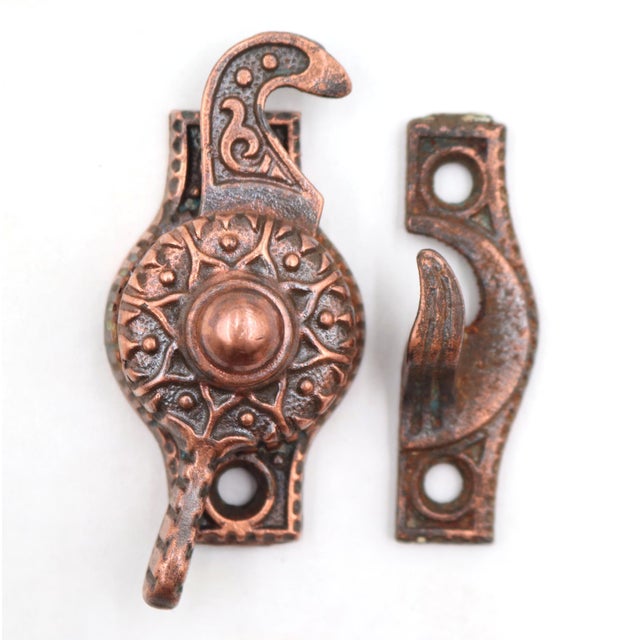 Victorian style window sash lock made of copper finish cast iron. The original mounting screws are not available. Good...