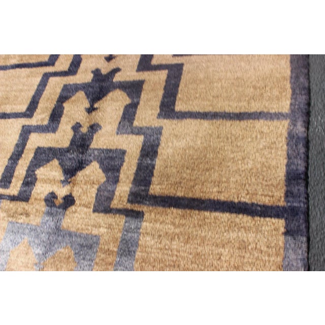 This vintage Tulu from mid-20th century Turkey boasts a mid century modern design with interconnected tribal pattern. The...