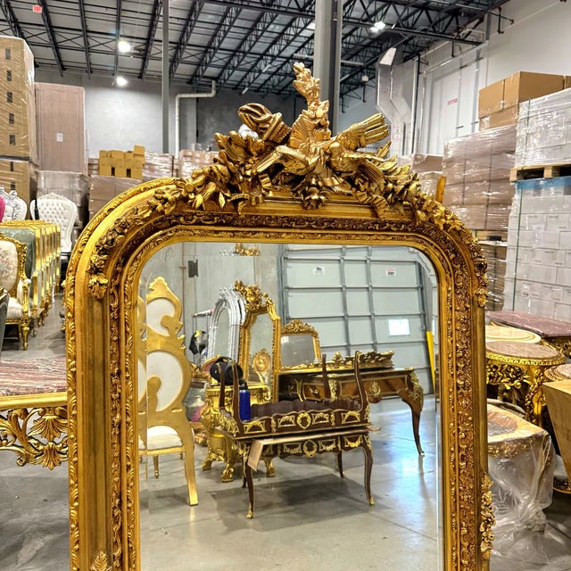 Fall in love with the unique design of this French style gold birds floor mirror. Featuring intricate bird details at the...