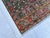 Persian Qashqai design hand-knotted rug featuring a navy diamond medallion filled with botehs and florets, flanked by tall...