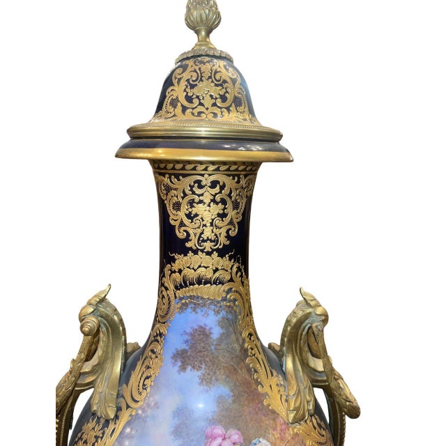 An impressive and monumental Sèvres porcelain lidded urn, richly decorated in the finest tradition of French decorative...