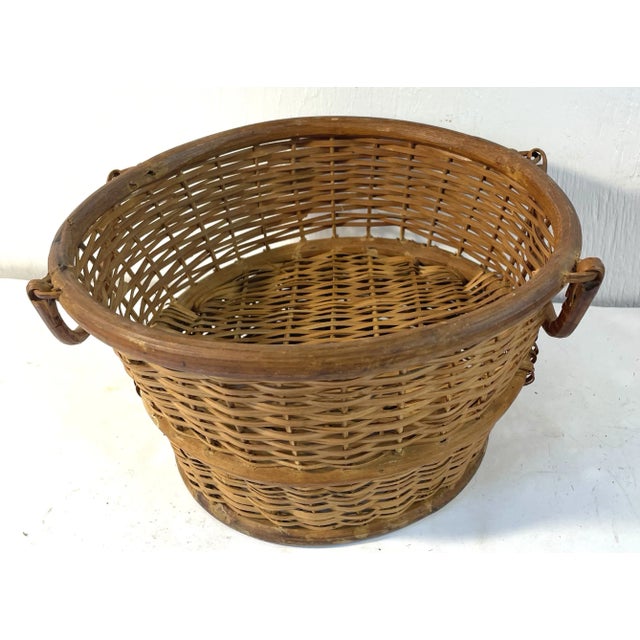 Nice vintage wicker raised bottom basket with handles on each side