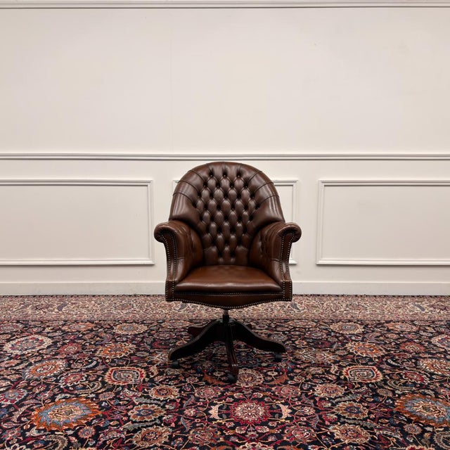 About this English Chesterfield Director’s Chair in Brown Classic and Elegant Antique office chairs in English, Classic...