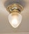Art Deco ceiling lamp, circa 1920. Dish-shaped brass body. Original frosted glass shade with star cut. The lamp has been...