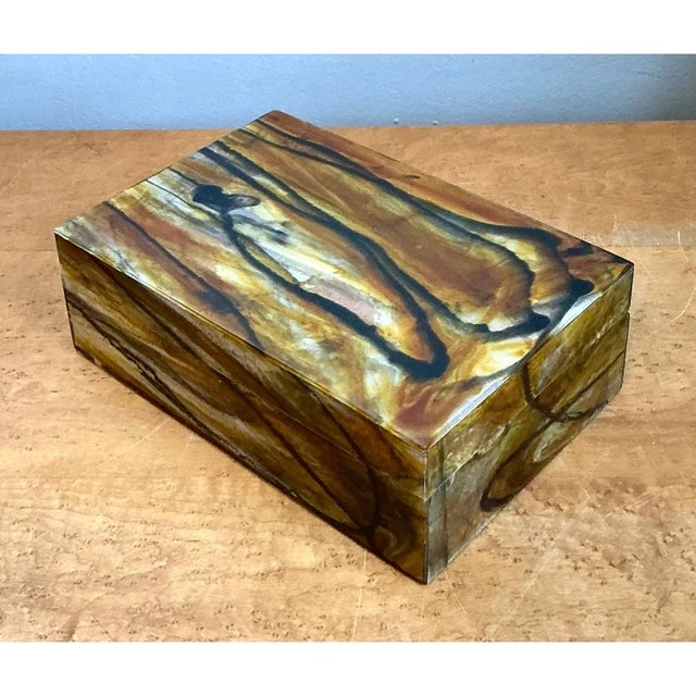 This vintage abstract resin box is a jewel-like object, its rectangular, softly squared silhouette finished with a fitted...