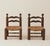 These elegant low fireside chairs by Charles Dudouyt have a woven rush seat with turned oak legs and ball structure on the...