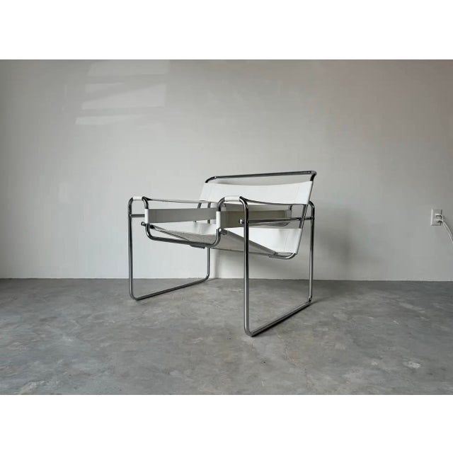 Vintage Marcel Breuer Wassily- style chrome and white leather sling lounge chair. Item features chrome metal frame with...