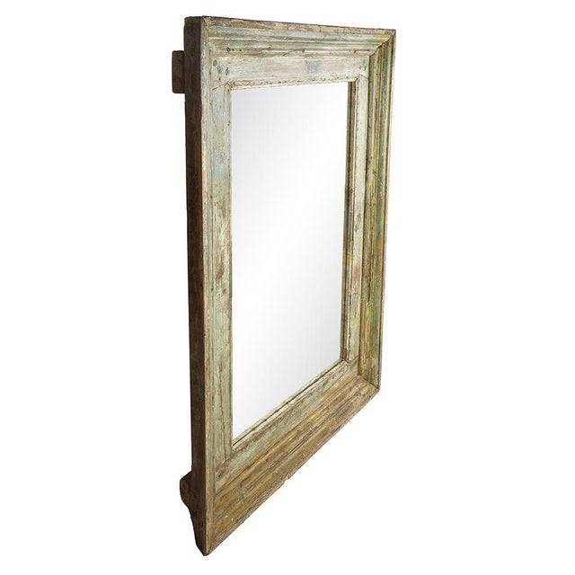 Large Patinated Wood Mirror, in Good conditions. This piece is designed in the style of the selected designer and/or...