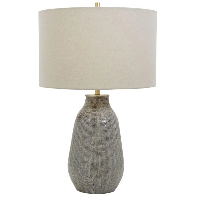 Exhibiting A Handcrafted Look, This Ceramic Table Lamp Features A Textured Finish Reminiscent Of Woven Fabric And Is...
