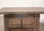 A charming vintage Chinese small cabinet crafted from solid elmwood, dating to the first half of the 20th century. The...