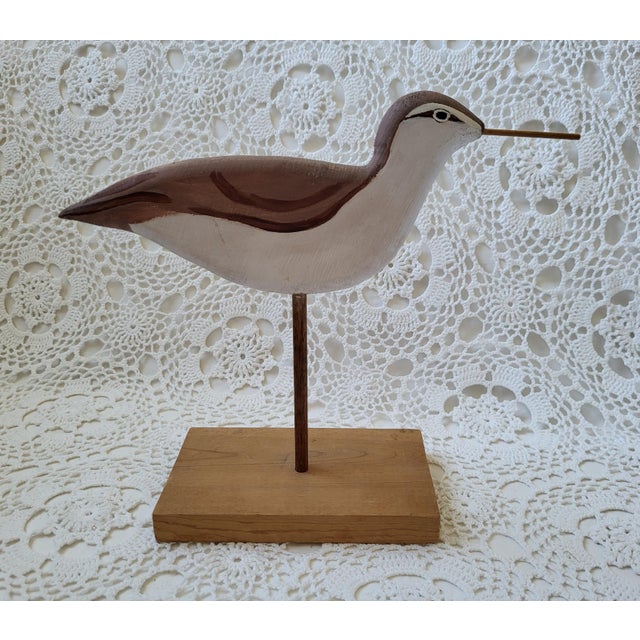 A handmade wooden shore bird decoy measureing 9 ¾” h, the base 6 ¼” x 3 ½”. The bird measures 11” from tail to beak. So...