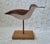 A handmade wooden shore bird decoy measureing 9 ¾” h, the base 6 ¼” x 3 ½”. The bird measures 11” from tail to beak. So...