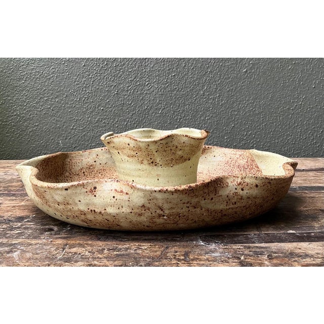 This vintage studio pottery appetizer bowl is a striking example of mid-century handcrafted stoneware, celebrated for its...
