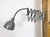 This vintage industrial adjustable gooseneck grey scissor wall light was produced by Elektroinstala Dečín in former...