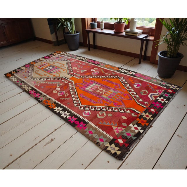 This striking vintage Kars kilim, hand-woven in the 1970s in Eastern Anatolia, represents a masterful example of...