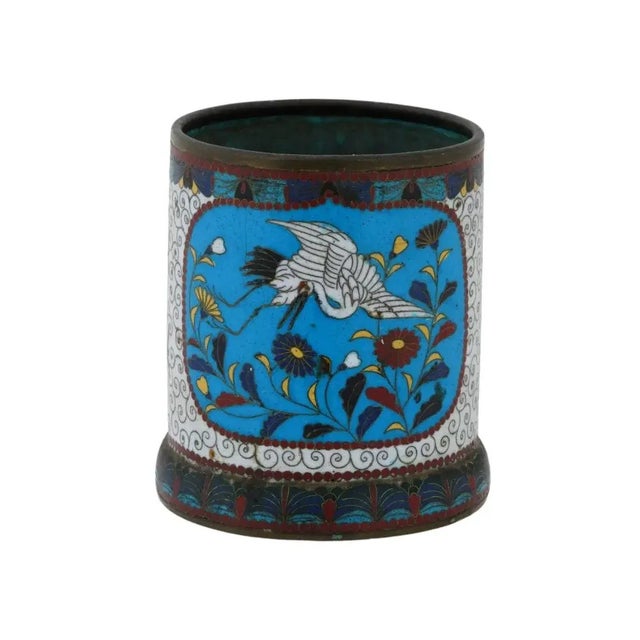 An antique Japanese Meiji Era cylindrical shaped enamel brush pot. Circa: 19th century. The cylindrical form pot is...