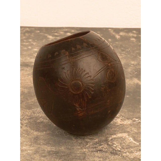 A Vintage Maté coconut cup made in South America circa 1920 on later custom steel stand.