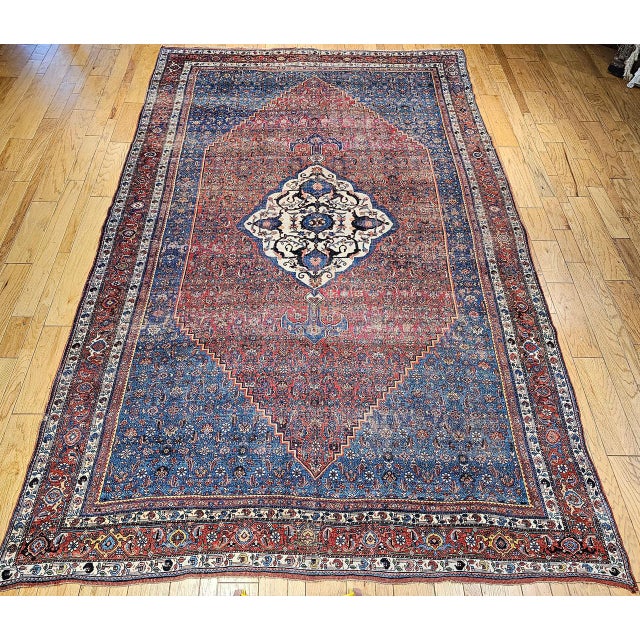 "This exquisite oversized Persian Bidjar rug is a masterful representation of late 19th-century Persian craftsmanship,...