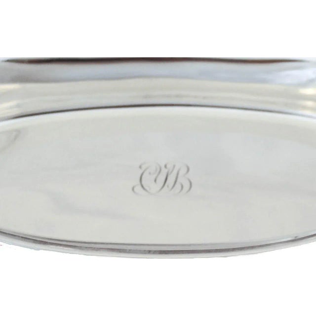 We are delighted to offer you this sterling silver dish by the world renowned Tiffany & Company. It has a canoe-like oval...