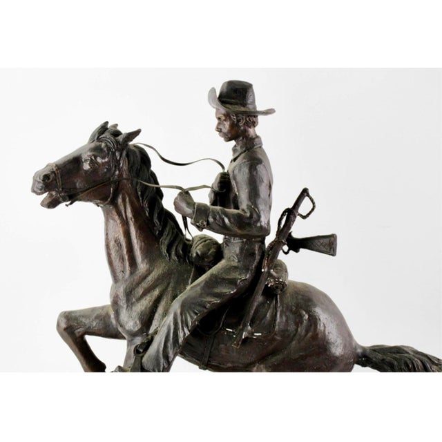 After Frederic Remington “Trooper of the Plains” Bronze Equestrian Sculpture on Marble Base One of the most iconic images...