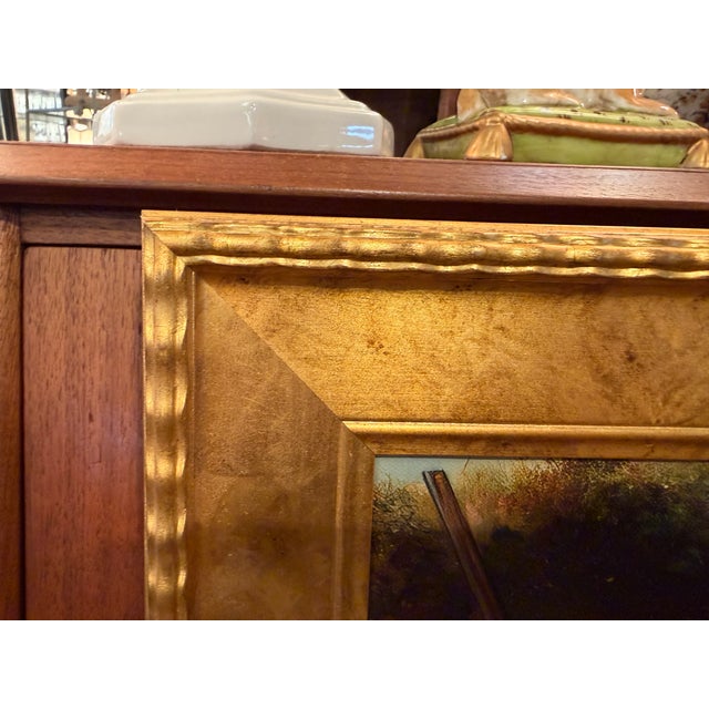 This print features two bird dogs after a successful hunt. The burnished gold frame features a delicate waving trim. This...