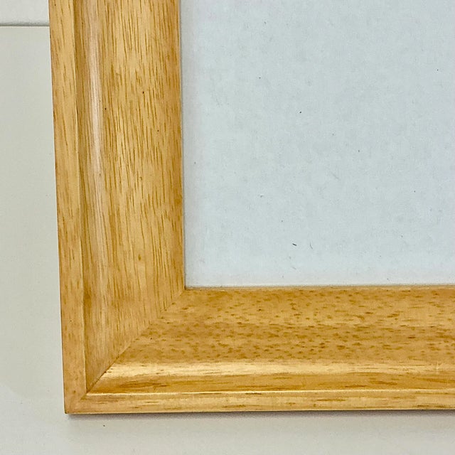 A lovely Fruitwood wide Picture Frame to enhance a favorite photograph. The wood is finished in a clear natural color. The...