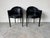 A striking pair of 1980’s Italian Art Deco–Postmodern club chairs, showcasing the bold sculptural silhouettes and glossy...