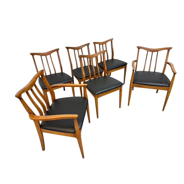 Elevate your dining space with this striking set of six Mid-Century Modern dining chairs by Blowing Rock Furniture....