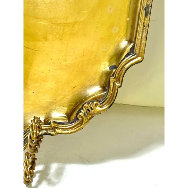 A substantial vintage brass tray with a distinctive square form, sculptural scalloped corners, and a warm polished finish....