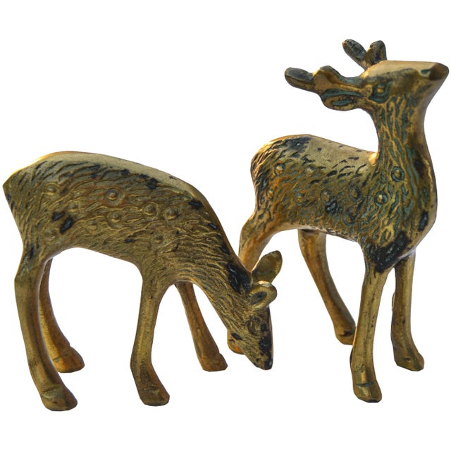 Set of two midcentury solid brass deer with intricate details. No maker's mark. Doe, 3.25”L x 1.25”W x 3”H. This gorgeous...