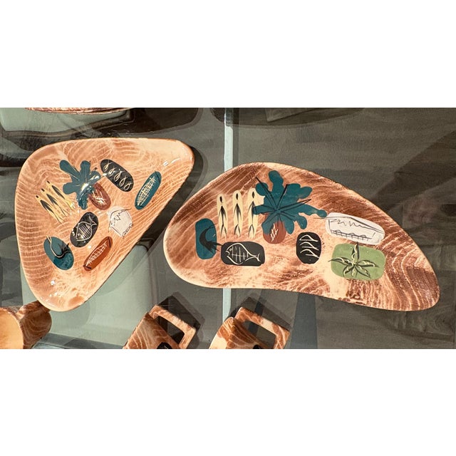 The Unique Serving Set by Marc Bellaire includes a collection of Friendly Island 10 plates, 9 cups, and 2 serving pieces...