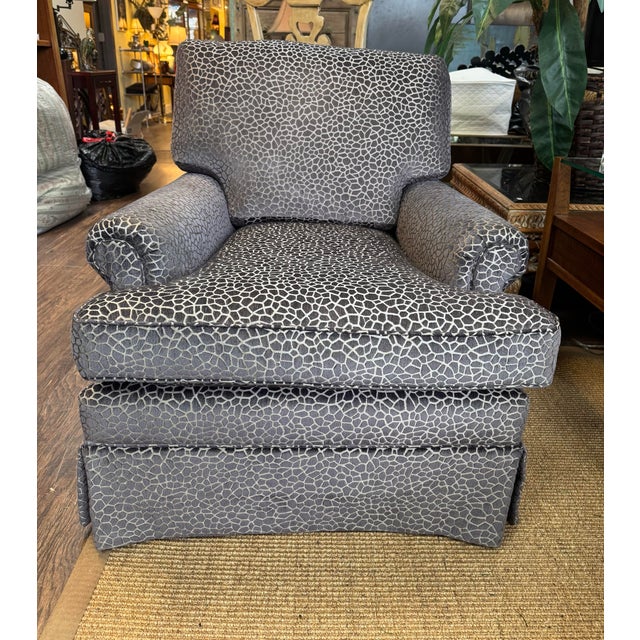 Newly reupholstered pair of generously proportioned club/lounge chairs featuring softly rolled arms, a supportive tight...