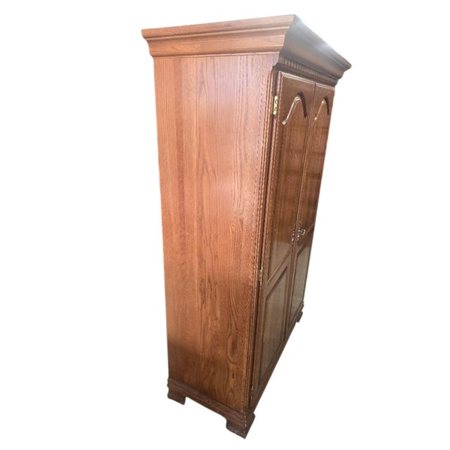 Substantial Kincaid Hunter’s Run entertainment armoire crafted in the USA from solid oak with a warm medium-brown finish....