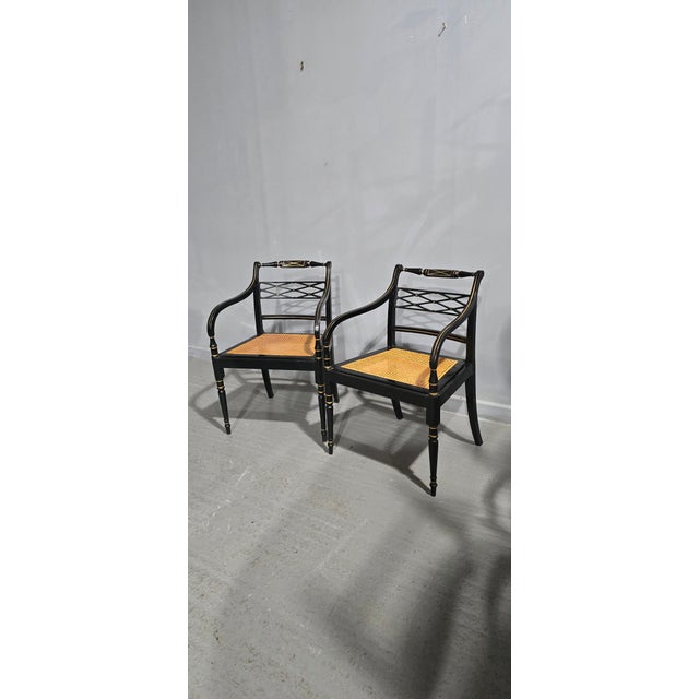 A very good Pair of Regency style black laquered and gilt detailed side chairs, with removable bergere seats, in overall...