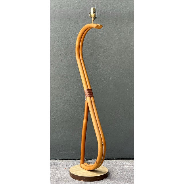 Illuminate your space with this stunning Vintage Coastal Bent Rattan Floor Lamp, a true embodiment of organic elegance and...