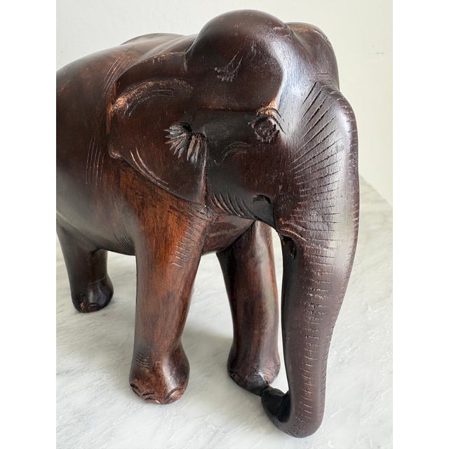 This hand-carved wooden elephant sculpture was originally acquired in India over a decade ago as a gift from a friend...