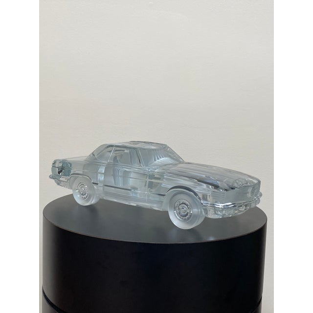 A finely crafted vintage crystal automobile sculpture produced by Daum France, modeled after a classic Mercedes-Benz...