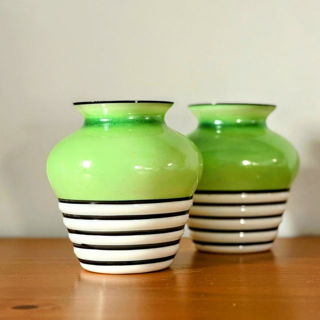 This pair of gorgeous, eye-catching vintage vases are something of an enigma. They have a distinctly Art Deco aesthetic...