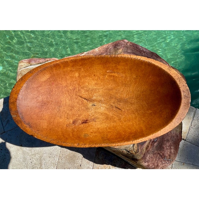 Antique wooden dough bowl - a veteran of decades of baking days. Shows the natural patina of wear you'd expect in an...