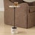 Brunson Features A Minimalist Dark Bronze Metal Stem, Elegantly Supporting A Round Tray Top And A Cylindrical Base. Both...