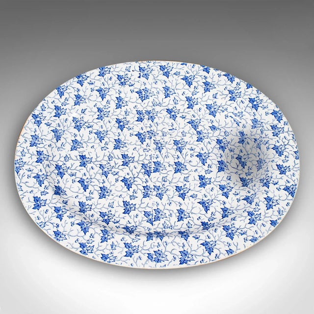 This is a large antique oval meat platter. An English, printed ceramic dinner serving plate, dating to the Victorian...