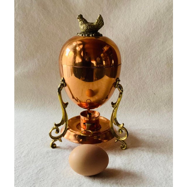 ….Discovered at a Vermont Country House Sale, this charming copper and brass egg coddler by Tagus of Portugal is a...