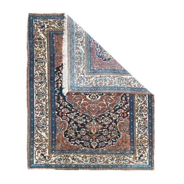 In amazing condition, this finely woven urban central Persian small scatter shows a slightly scalloped ogival red...